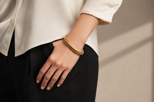 18 kt. Yellow Gold Bonded Twisted Hinged  Bangle by UNOAERRE